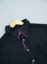 Load image into Gallery viewer, Black fabric with ppink stitching on grass