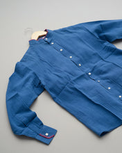 Load image into Gallery viewer, Blue shirt on grass