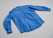 Load image into Gallery viewer, Blue shirt on grass
